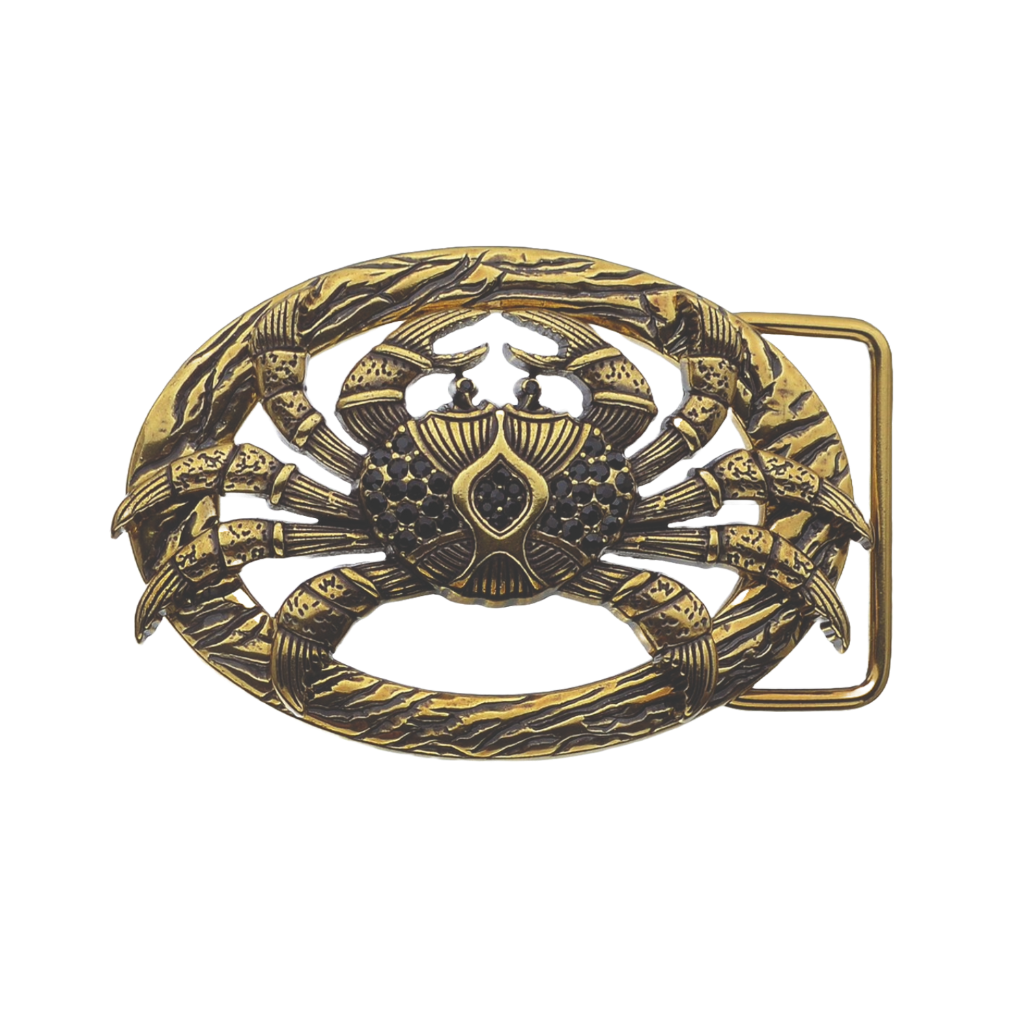 Gold crab-shaped belt buckle on a white background
