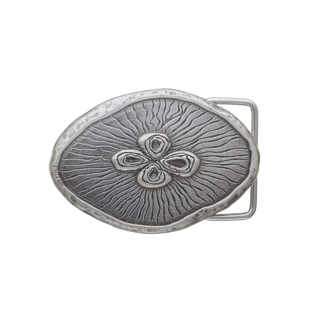 A detailed, sculpted silver belt buckle. This unique fashion accessory features an abstract, organic design with a central four-part pattern and radiating lines, with an artistic look that suggests a high-quality Italian design aesthetic.