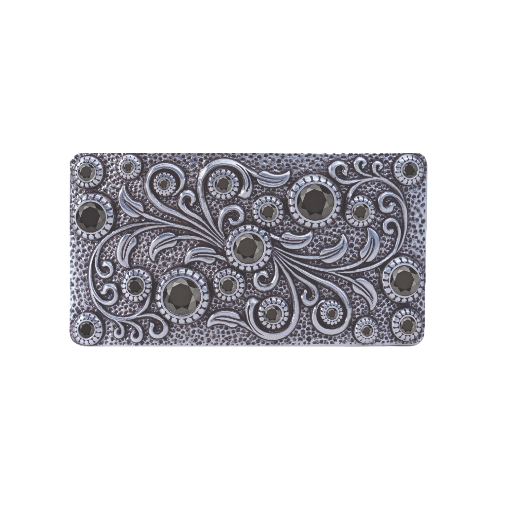A detailed, ornate silver belt buckle. This unique fashion accessory features an intricate floral and scrollwork pattern embellished with various sizes of black gems, with a look that suggests a high-quality Italian design aesthetic.