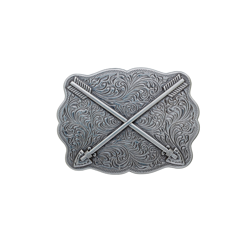 A detailed silver belt buckle with a Western design. This fashion accessory features two crossed arrows over an ornate background of scrollwork and patterns.