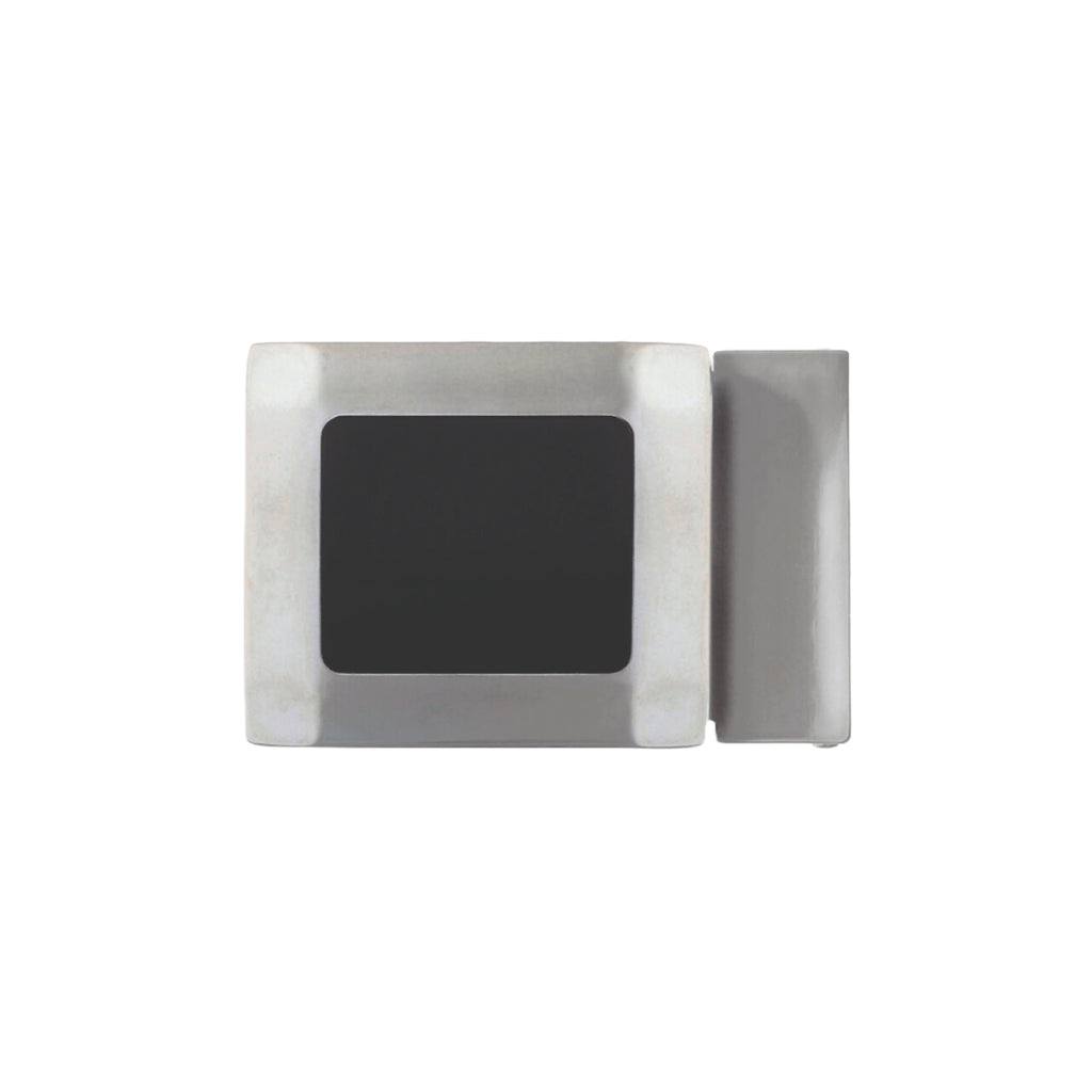 Minimalist silver-tone rectangular belt buckle featuring a beveled frame and a central matte black inset panel.