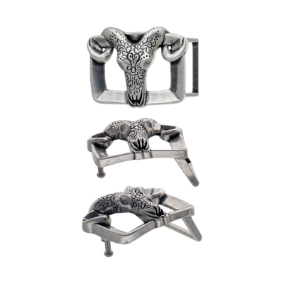 Engraved ram-skull buckle, antique silver finish with curved horns, three-quarter view showing hardware