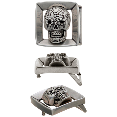 Silver belt buckle with skull design on a white background