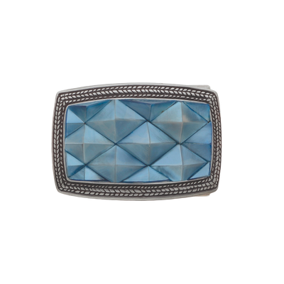 Polished silver belt buckle with a textured braided border and a large rectangular light blue glass centerpiece with a faceted diamond pattern, a modern fashion accessory with an Italian design.

