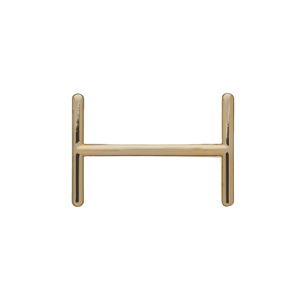 Polished gold belt buckle center bar hardware for strap attachment