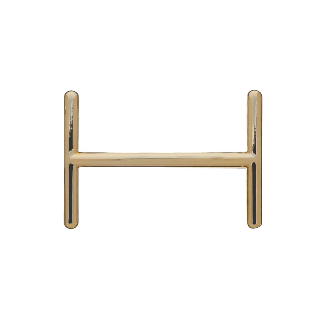 Polished gold belt buckle center bar hardware for strap attachment