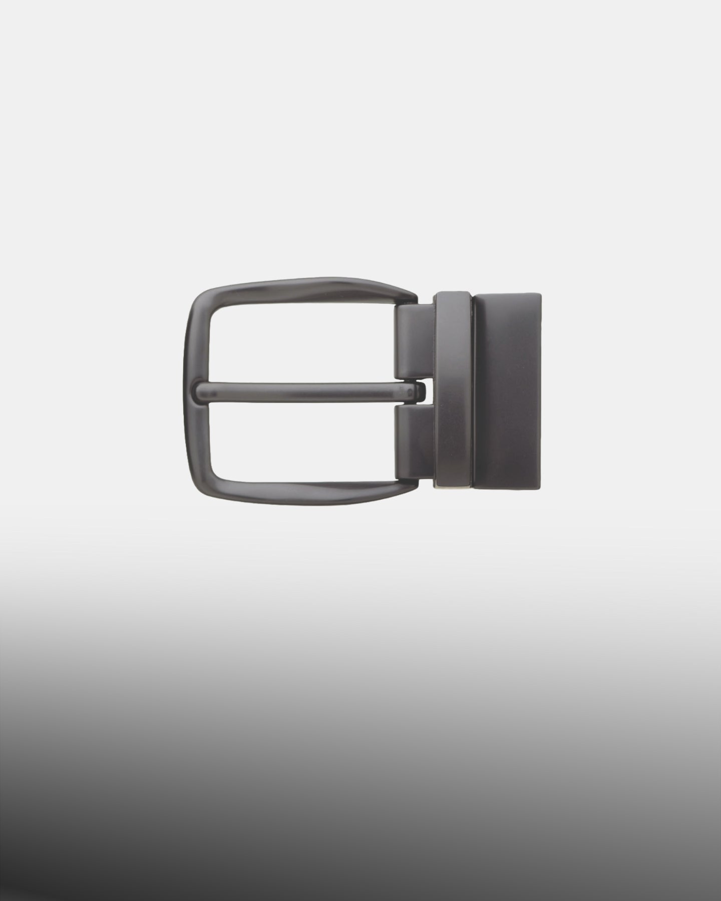 Matte black rectangular belt buckle with a rotating reversible frame and single prong.