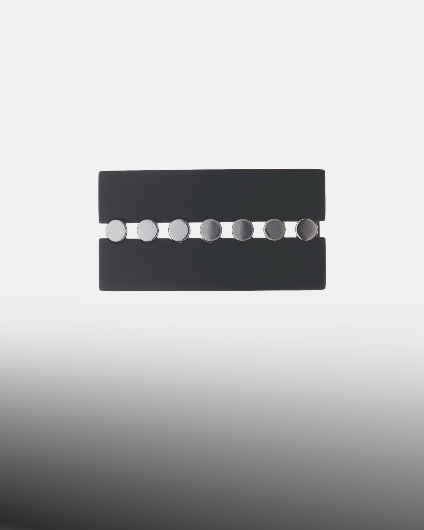 Polished silver oval belt buckle with a matching oval frame and single prong.